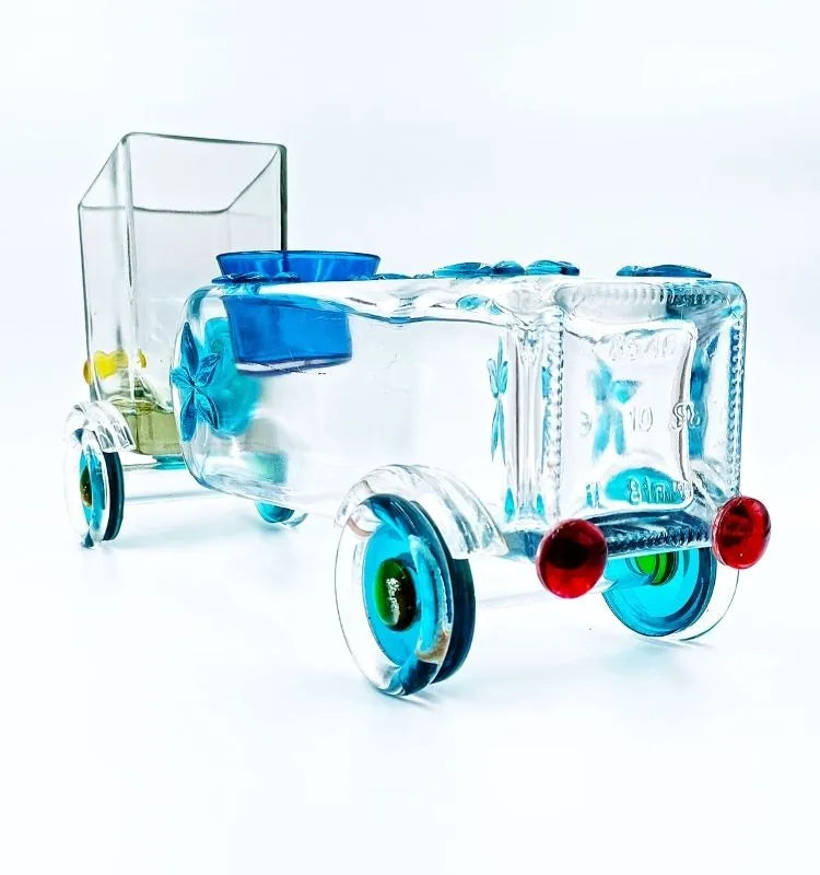 Colorful Legacy Lane Truck Planter handcrafted from an upcycled Gold Label whisky bottle – sustainable truck-shaped décor perfect for succulents or candles, blending creativity with eco-living.