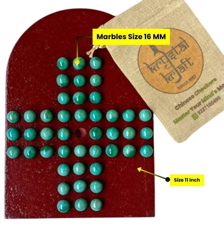 Close-up of colourful glass marbles on Brainvita marble solitaire board