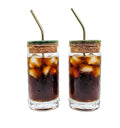 Eco friendly upcycled glass sipper on wooden table with water sustainable drinkware