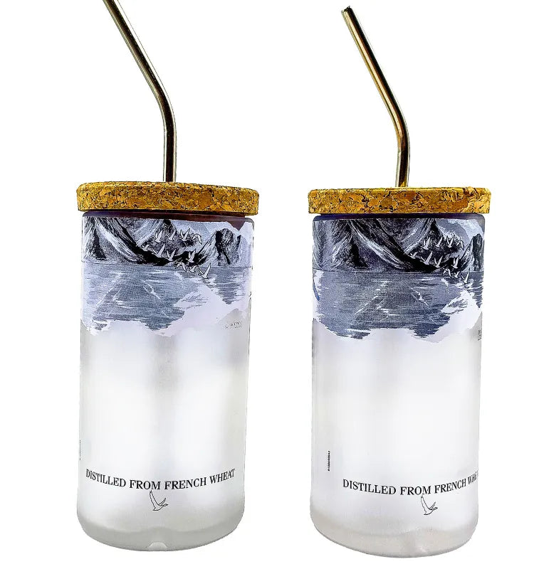Iced drink in sustainable upcycled Grey Goose glass tumbler with stainless steel straw
