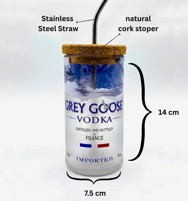Eco friendly upcycled glass sipper filled with water, plastic-free drinkware