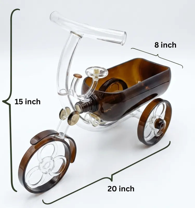Close-up of the handcrafted cut glass and wheels on a brown tricycle bottle planter