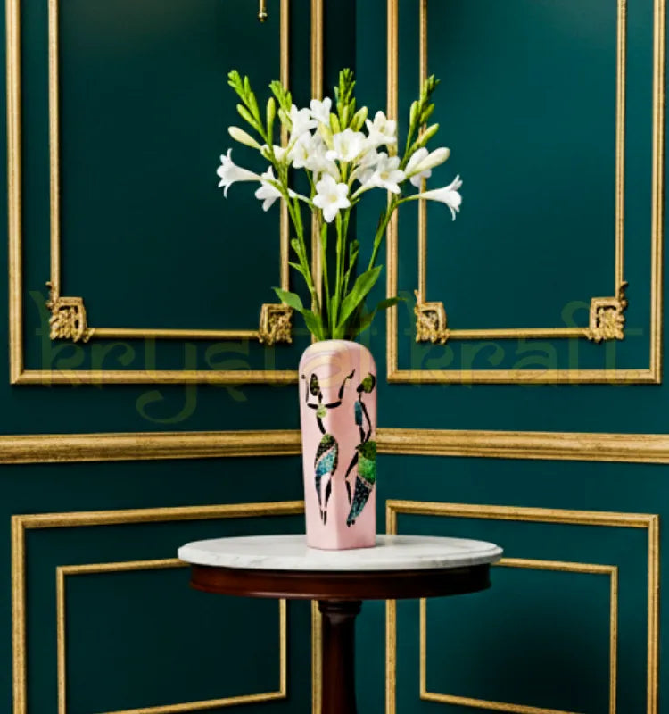 Beautifully hand-painted recycled glass bottle vase by Farisa Merchant featuring a Dancing African Lady in vibrant acrylic hues on a soft pink background — perfect eco-friendly décor accent for modern homes.