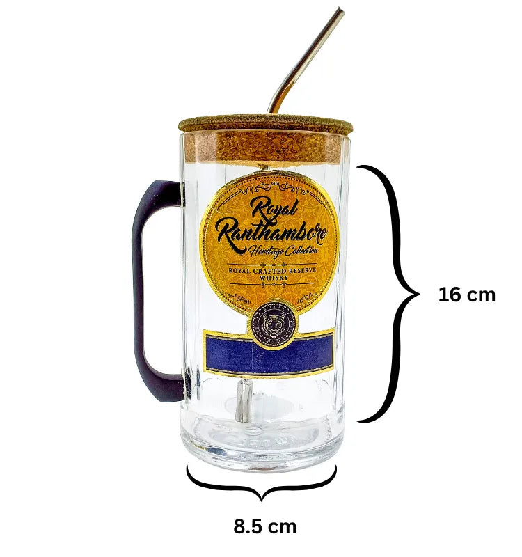 Hand holding the sustainable Royal Ranthambore sipper mug filled with coffee on a work desk