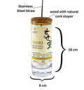 Close-up of reusable stainless steel straw on upcycled Indri whisky bottle sipper