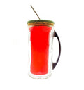 Hand holding eco friendly upcycled bottle mug filled with coffee