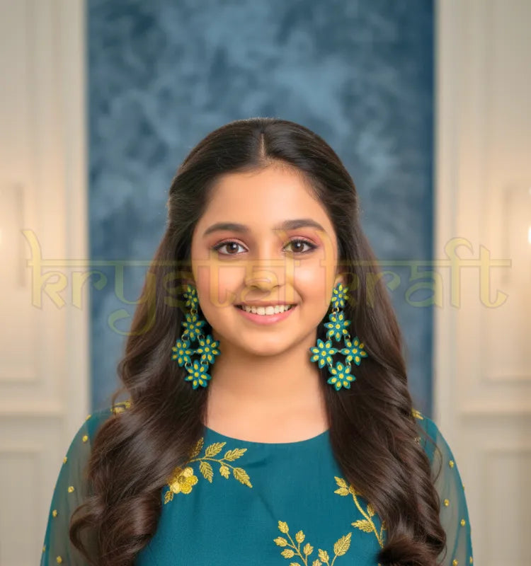 Unique floral quilled earrings styled on model with Indo-western outfit, showcasing lightweight Indian artisan jewelry for parties and special occasions”